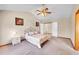 The main bedroom features a vaulted ceiling and plush carpeting creating a cozy atmosphere at 8167 S Dover St, Littleton, CO 80128