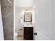 Small bathroom features a shower and a sink with a dark vanity at 2756 E Euclid Ave, Centennial, CO 80121