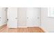 Empty bedroom featuring wood floors, white walls, and natural light at 2756 E Euclid Ave, Centennial, CO 80121