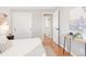 Bright bedroom with hardwood floors, white walls and doors leading to other parts of the house at 2756 E Euclid Ave, Centennial, CO 80121