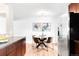 Breakfast nook with stainless steel appliances, round glass table and seating for four at 2756 E Euclid Ave, Centennial, CO 80121