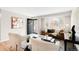 Bright living room with hardwood floors, stylish decor, and a view to the front door at 2756 E Euclid Ave, Centennial, CO 80121
