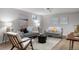 Living room with modern furnishings, gray couches, neutral rug and recessed lighting at 2756 E Euclid Ave, Centennial, CO 80121