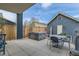 Backyard patio with hot tub and dining furniture, perfect for outdoor entertaining and relaxation at 35 Elati St, Denver, CO 80223