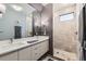 Modern bathroom featuring dual sinks, a spacious shower, and contemporary finishes at 35 Elati St, Denver, CO 80223