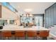 Bright, modern kitchen with a large island, stylish seating, and stainless steel appliances at 35 Elati St, Denver, CO 80223
