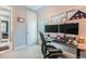 Functional home office featuring a modern desk setup, natural light, and ample workspace at 35 Elati St, Denver, CO 80223