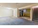 Unfinished basement with large open area and stairs at 5493 Quari St, Denver, CO 80239