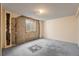 Unfinished basement room with exposed pipes and window at 5493 Quari St, Denver, CO 80239