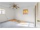 Bedroom with ceiling fan and partial exposed subfloor at 5493 Quari St, Denver, CO 80239