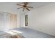 Spacious bedroom with double doors and ceiling fan at 5493 Quari St, Denver, CO 80239