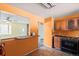 Kitchen area with a breakfast bar and view into living room at 5493 Quari St, Denver, CO 80239