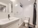 Modern bathroom features a pedestal sink, and tiled floors at 1824 S Columbine St, Denver, CO 80210