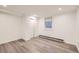 Finished bedroom with modern floors, white walls, and recessed lighting at 1824 S Columbine St, Denver, CO 80210