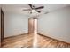 Bright bedroom featuring hardwood floors, a ceiling fan, and neutral paint at 1824 S Columbine St, Denver, CO 80210