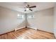 Large bedroom with hardwood floors, a ceiling fan, and natural light at 1824 S Columbine St, Denver, CO 80210