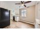 Bright kitchen features white cabinets, modern appliances, and wood-look flooring at 1824 S Columbine St, Denver, CO 80210