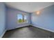 Blue bedroom features carpet, a mountain view from the window, and neutral trim at 31231 Red Hawk Trl, Conifer, CO 80433