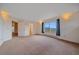 Spacious bedroom with great natural light, plush carpeting, and hallway access at 31231 Red Hawk Trl, Conifer, CO 80433