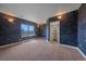 Textured dark blue bedroom with carpet, a closet, and a window with a great view at 31231 Red Hawk Trl, Conifer, CO 80433