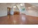 Bonus room features wood floors, unique ceiling, built in cabinets, and mountain views at 31231 Red Hawk Trl, Conifer, CO 80433