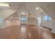 Large bonus room with unique ceiling, wood floors, recessed lights, and mountain views at 31231 Red Hawk Trl, Conifer, CO 80433