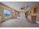 Spacious bonus room has carpet, a wet bar, a ceiling fan, and great views at 31231 Red Hawk Trl, Conifer, CO 80433