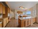Spacious kitchen with wood cabinets, white appliances, ample counter space, and mountain view window at 31231 Red Hawk Trl, Conifer, CO 80433