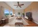 Spacious living room featuring comfortable seating, hardwood floors, and stunning mountain views at 31231 Red Hawk Trl, Conifer, CO 80433