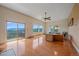 Spacious living room featuring hardwood floors, large windows with great views, and comfortable furniture at 31231 Red Hawk Trl, Conifer, CO 80433