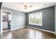 Bright bedroom featuring a window view and wood floors at 5789 S Jay St, Littleton, CO 80123