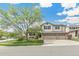 Charming two-story home featuring a three-car garage, landscaped yard, and a beautiful mature tree at 5789 S Jay St, Littleton, CO 80123