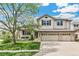Beautiful two-story home with brick accents and three-car garage at 5789 S Jay St, Littleton, CO 80123
