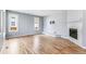 Bright living room features a fireplace and hardwood floors at 5789 S Jay St, Littleton, CO 80123