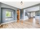 Spacious living room with hardwood floors, gray walls, and staircase leading to the second level at 5789 S Jay St, Littleton, CO 80123
