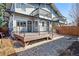Exterior view of a multi-level deck with stairs to the backyard with gravel landscaping at 1401 S Clarkson St, Denver, CO 80210