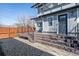 Backyard featuring a deck with steps down to a gravel yard at 1401 S Clarkson St, Denver, CO 80210