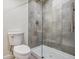 Contemporary bathroom featuring sleek glass-enclosed shower and modern toilet at 1401 S Clarkson St, Denver, CO 80210