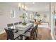 Elegant dining area with stylish lighting and a glass-top dining table at 1401 S Clarkson St, Denver, CO 80210