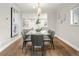 Stylish dining room with a modern table, chandelier, and open layout at 1401 S Clarkson St, Denver, CO 80210