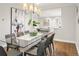 Modern dining room open to living areas, featuring hardwood floors and contemporary decor at 1401 S Clarkson St, Denver, CO 80210
