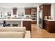 Well-appointed kitchen features a large island, stainless steel appliances, and custom cabinetry at 1401 S Clarkson St, Denver, CO 80210