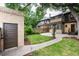 Well-maintained backyard with stone patio, pergola, and grass, ideal for outdoor enjoyment at 1308 York St, Denver, CO 80206