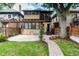 Beautiful backyard with pergola, mature trees and landscaping that offers a serene outdoor retreat at 1308 York St, Denver, CO 80206