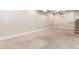 Open basement space with neutral carpet and a small basement window for natural light at 1308 York St, Denver, CO 80206
