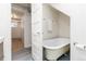 Bathroom boasts claw foot tub and access to additional basement space at 1308 York St, Denver, CO 80206
