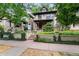 Charming brick home with landscaped front yard, inviting entrance, and a 'for sale' sign at 1308 York St, Denver, CO 80206