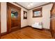 Foyer features hardwood floors, decorative door, stain glass window and decorative millwork at 1308 York St, Denver, CO 80206