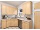 Spacious kitchen with stainless steel appliances, light wood cabinets, and tile floors at 1308 York St, Denver, CO 80206