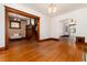 Spacious living room with hardwood floors and trim, and an open staircase at 1308 York St, Denver, CO 80206
